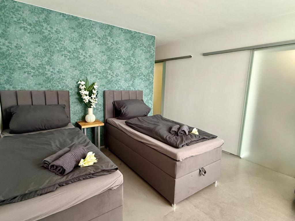 a bedroom with two beds at Apartment 1 in Pulheim