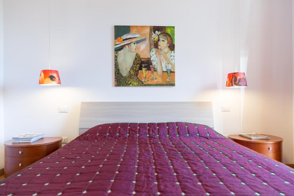 A bed or beds in a room at Guest House Le Acacie