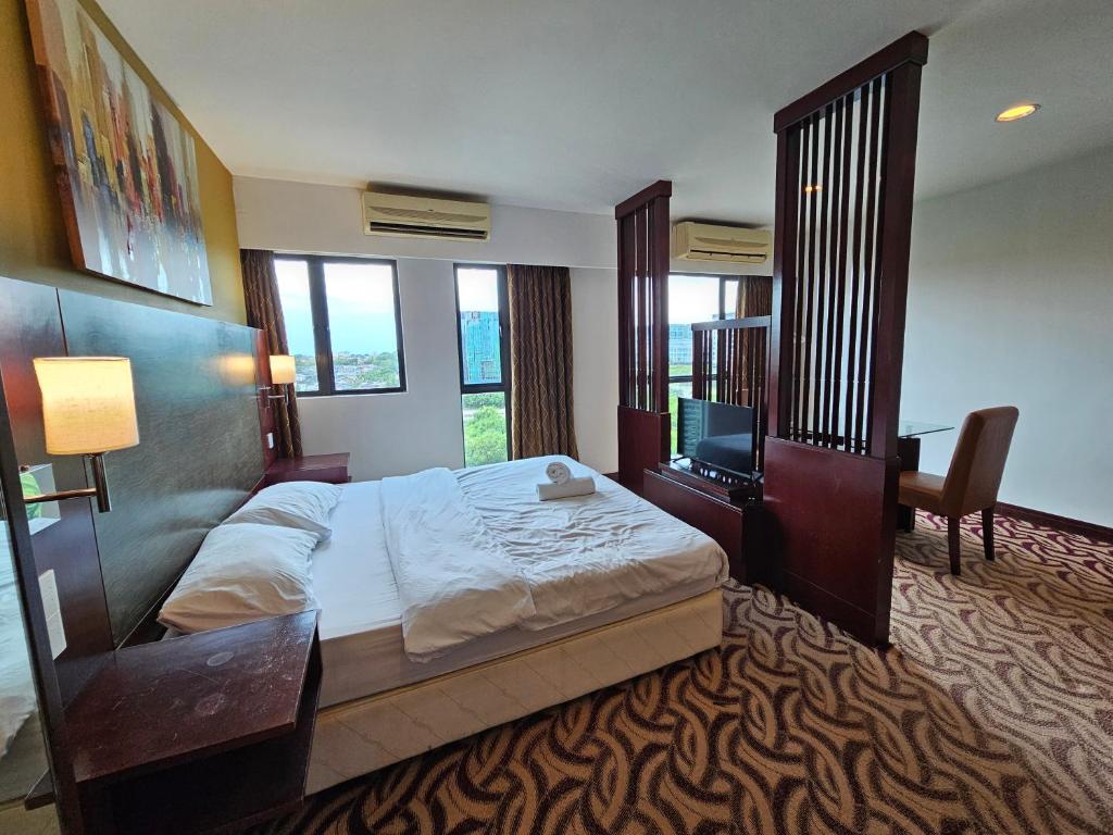 Postel nebo postele na pokoji v ubytování Kota Kinabalu City Ensuite at SCSP Ming Garden