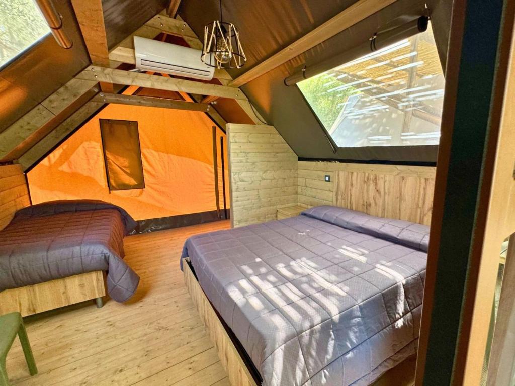 Postel nebo postele na pokoji v ubytování Hostel & Glamping Santa Fortunata