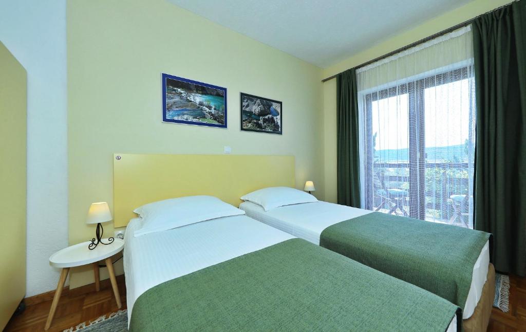 Postel nebo postele na pokoji v ubytování Hotel Rajna
