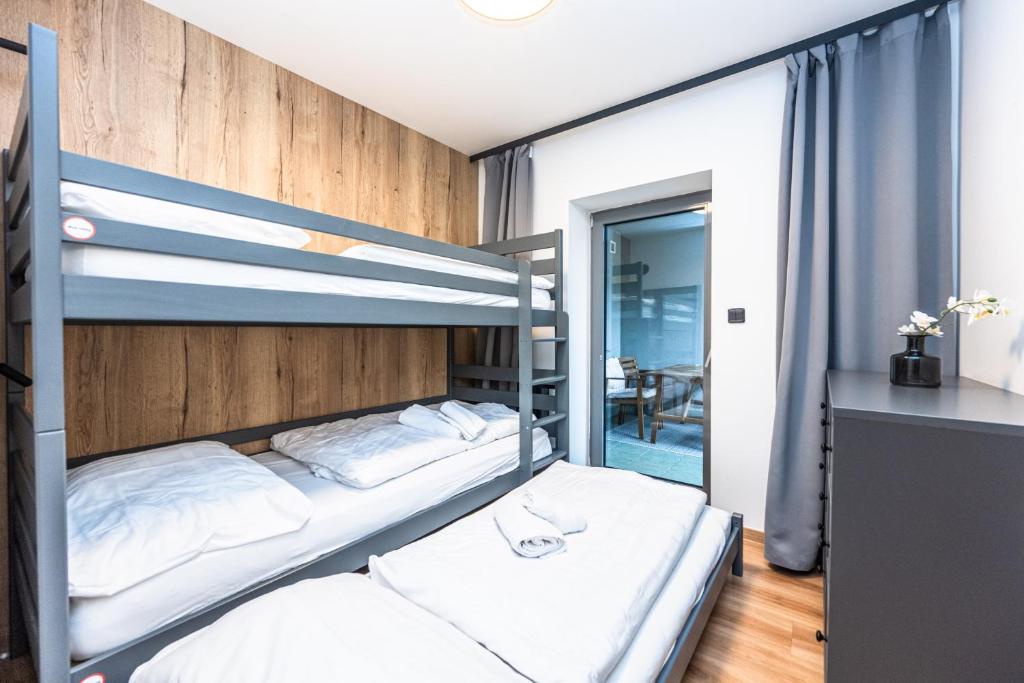 Postel nebo postele na pokoji v ubytování Apartmán Harrachov ADOS 005 Mumlava