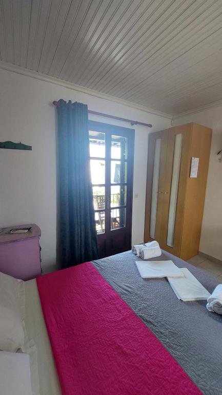 Postel nebo postele na pokoji v ubytování SunRiseStudiosPapanero