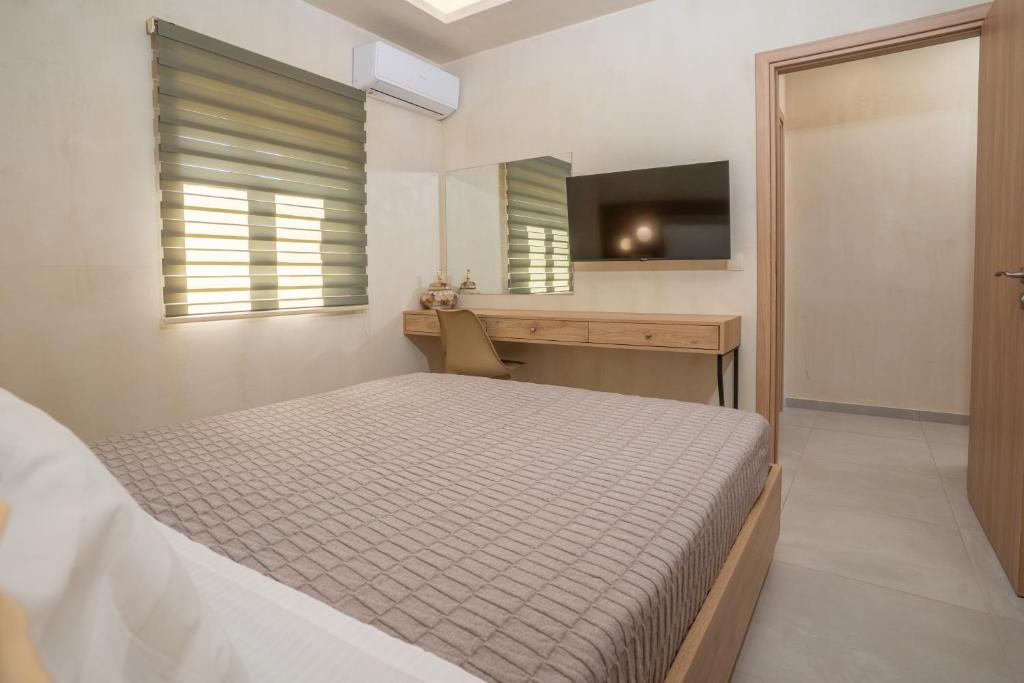A bed or beds in a room at Pasithea