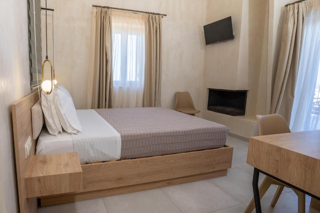 A bed or beds in a room at Pasithea