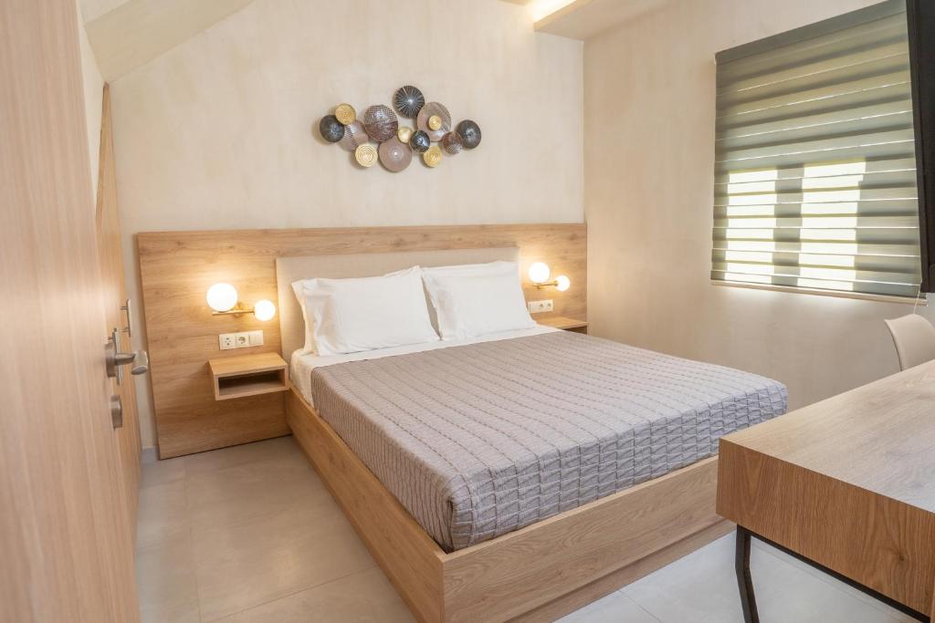 A bed or beds in a room at Pasithea