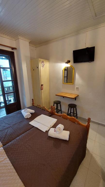 Postel nebo postele na pokoji v ubytování SunRiseStudiosPapanero