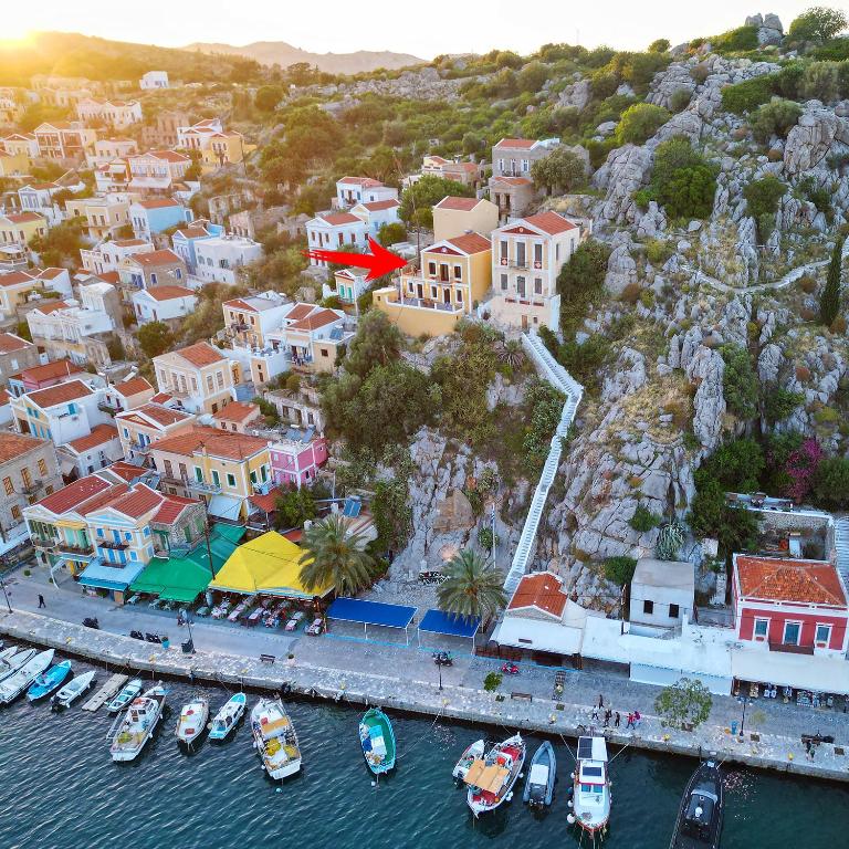 an aerial view of a town with boats in the water at Lirenou Scala Vista in Symi
