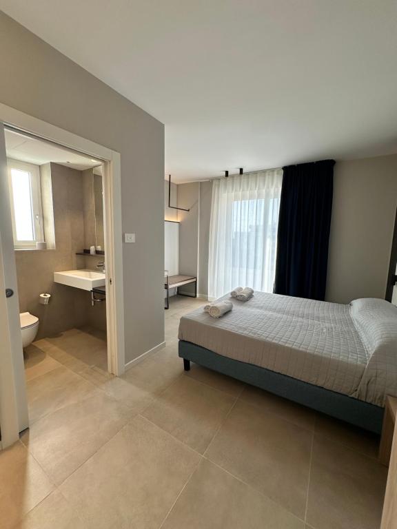 Posteľ alebo postele v izbe v ubytovaní Petit Hotel