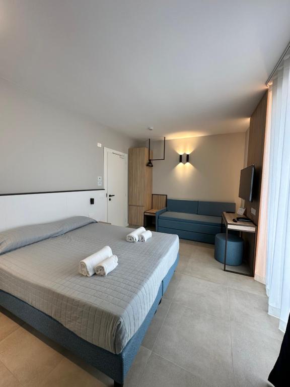 Posteľ alebo postele v izbe v ubytovaní Petit Hotel