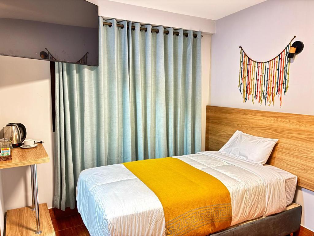 Postel nebo postele na pokoji v ubytování Hotel Litan Machu Picchu