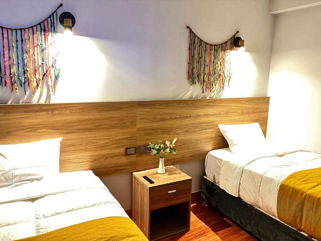 Postel nebo postele na pokoji v ubytování Hotel Litan Machu Picchu
