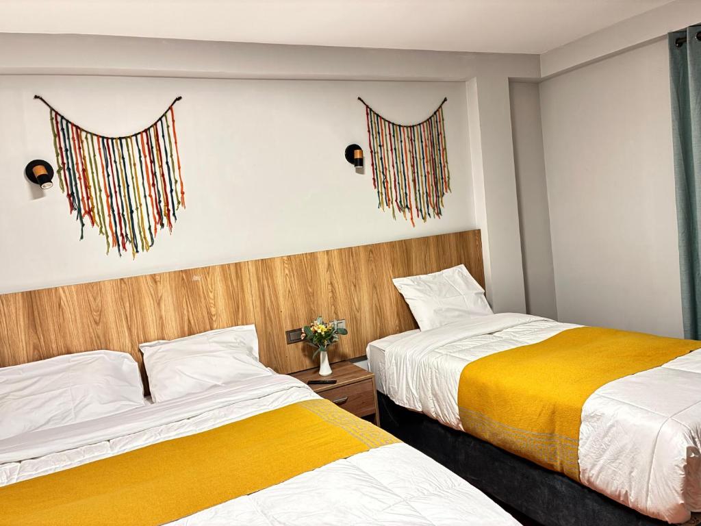 Postel nebo postele na pokoji v ubytování Hotel Litan Machu Picchu