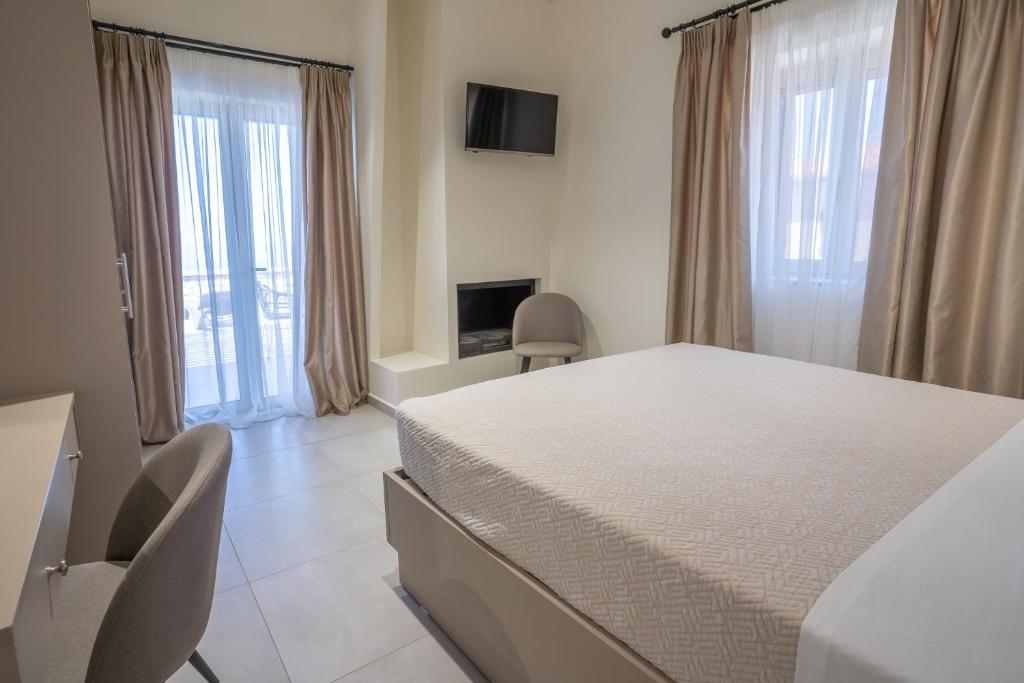 A bed or beds in a room at Pasithea