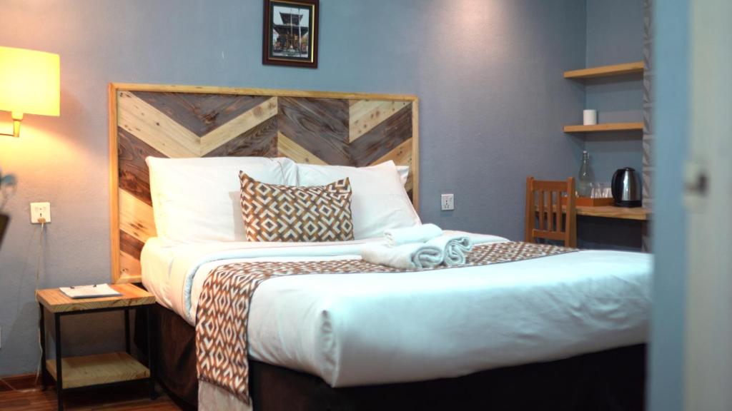 Postel nebo postele na pokoji v ubytování Nyadha House Bed & Breakfast