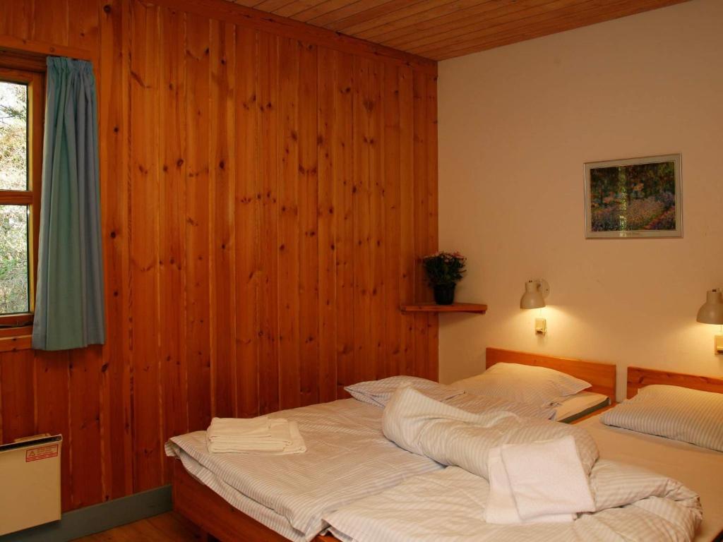 Postel nebo postele na pokoji v ubytování Marielyst Holiday Center