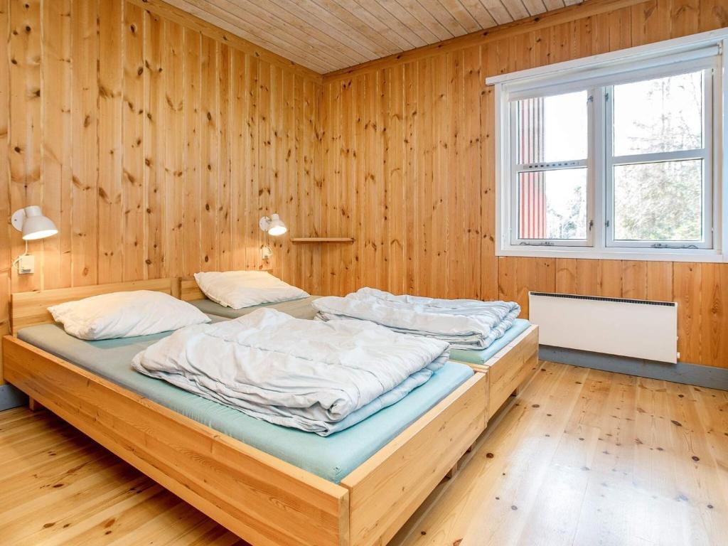 Postel nebo postele na pokoji v ubytování Marielyst Holiday Center
