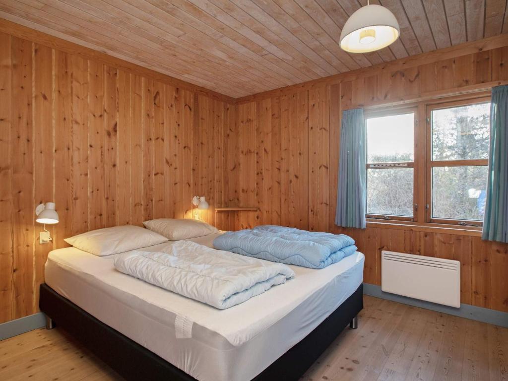 Postel nebo postele na pokoji v ubytování Marielyst Holiday Center
