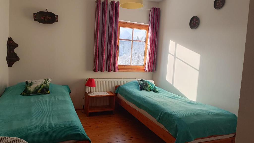 Postel nebo postele na pokoji v ubytování Agroturystyka Pod Świerkiem