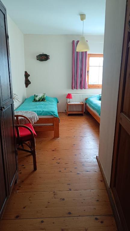 Postel nebo postele na pokoji v ubytování Agroturystyka Pod Świerkiem