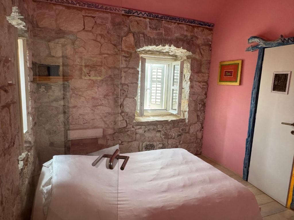 Postel nebo postele na pokoji v ubytování La Belle et la Bête