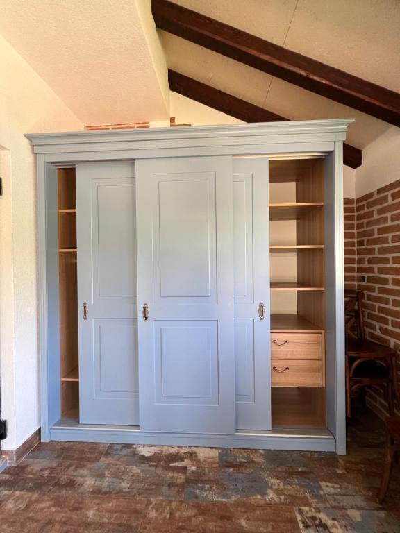 a closet with a door in a room at Villa SHU in Krimovice