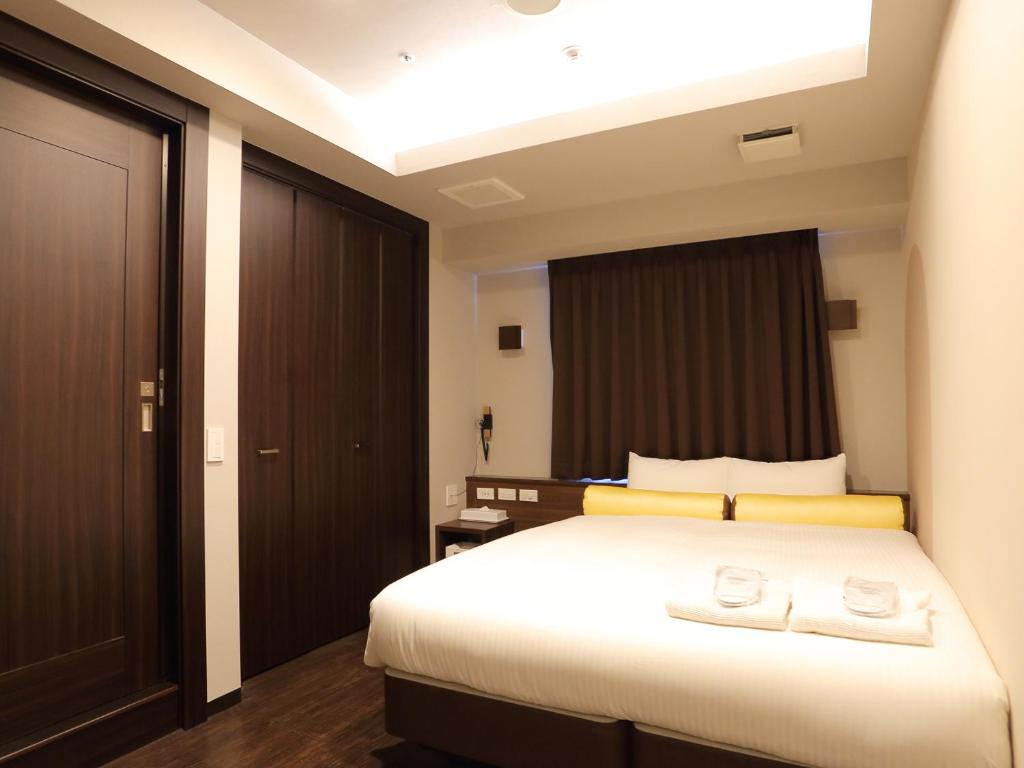 Postel nebo postele na pokoji v ubytování RE Hotel 谷町9丁目2