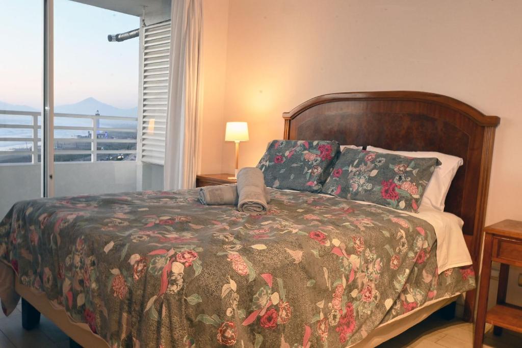 Postel nebo postele na pokoji v ubytování Smart Host Rentals - Línea Vista al Mar y El faro