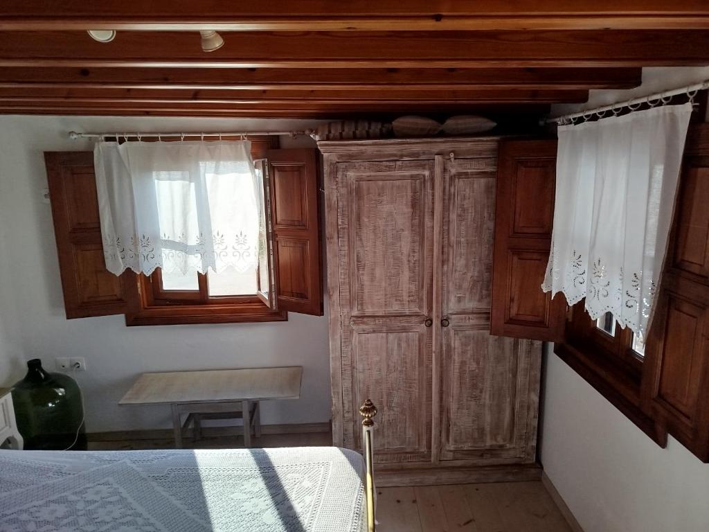 Postel nebo postele na pokoji v ubytování Manos House in Chora