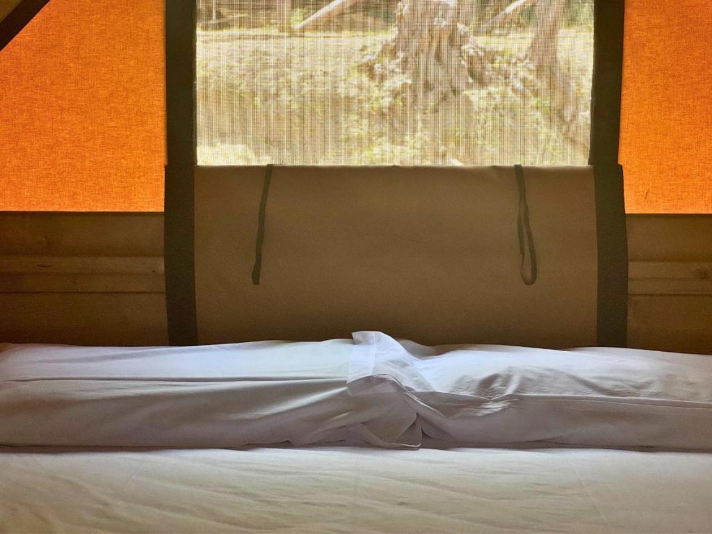Postel nebo postele na pokoji v ubytování Hostel & Glamping Santa Fortunata