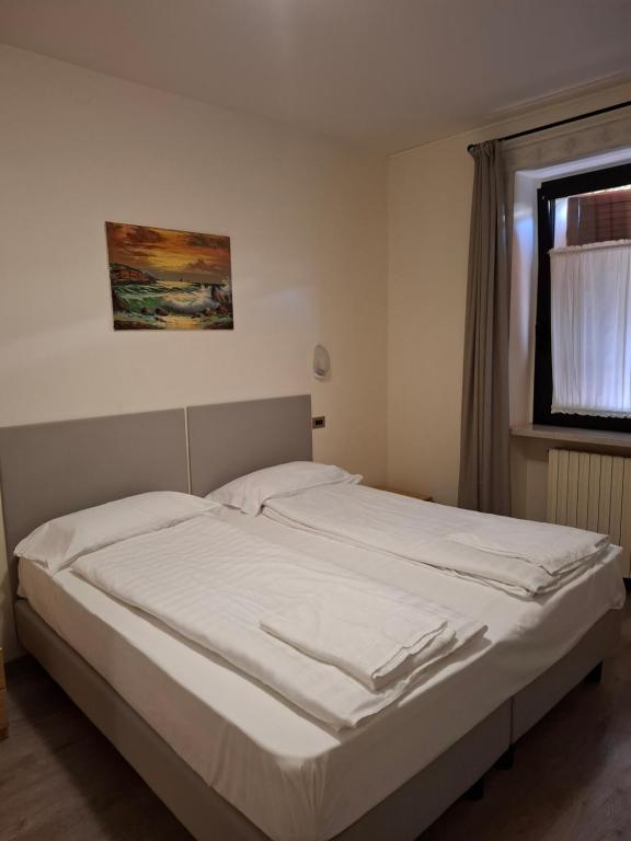 Postel nebo postele na pokoji v ubytování Garni Onda