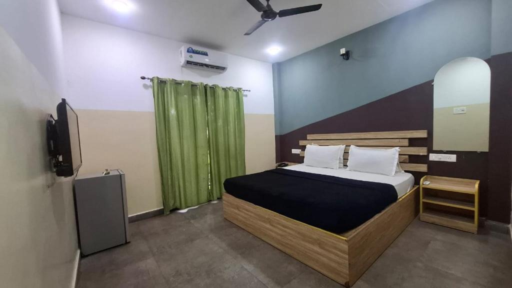 Postel nebo postele na pokoji v ubytování Bhattacharya holiday homes goa