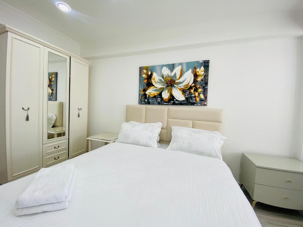 Ένα ή περισσότερα κρεβάτια σε δωμάτιο στο Apartament new Chișinău