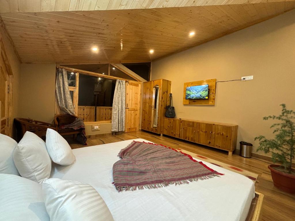 Ένα ή περισσότερα κρεβάτια σε δωμάτιο στο Rustic Roots Home Stay