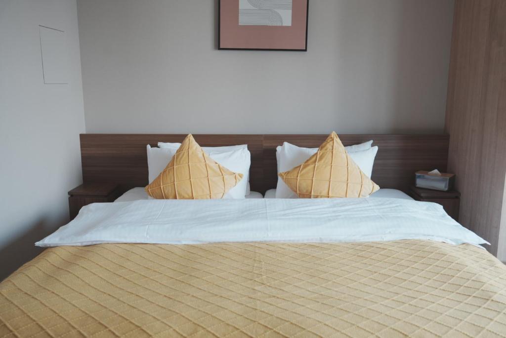 Postel nebo postele na pokoji v ubytování ICHIYU HOTEL ASAKUSA