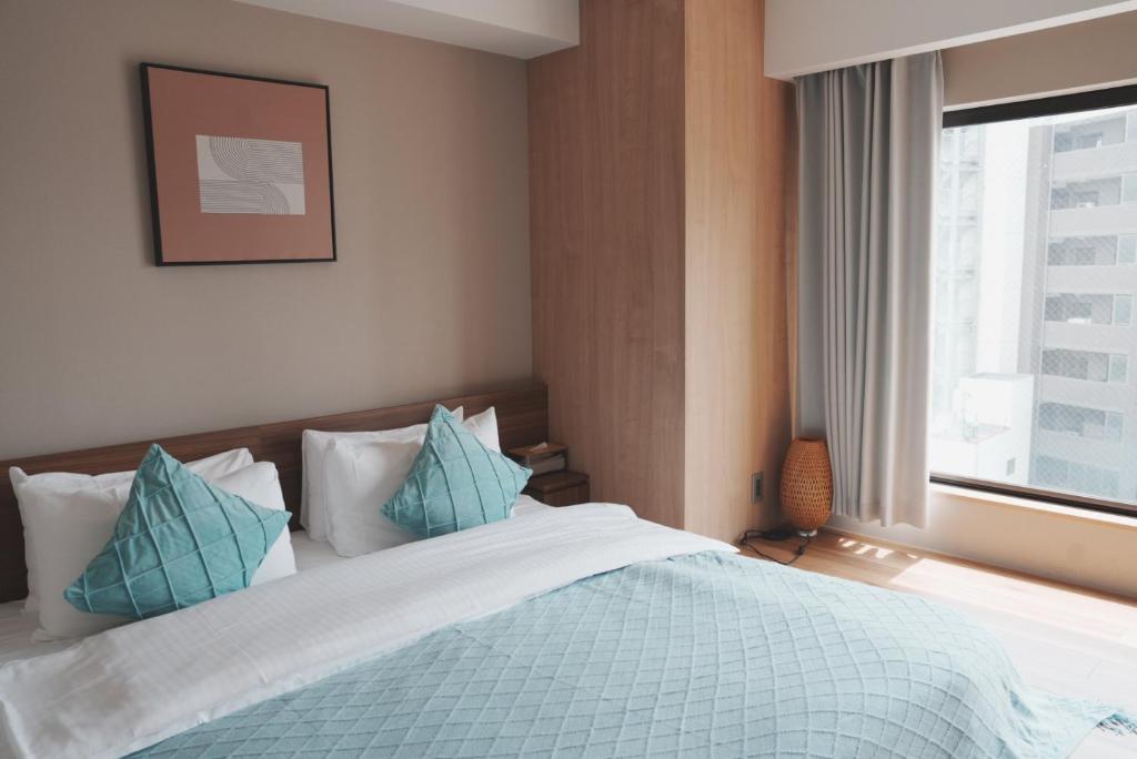 Postel nebo postele na pokoji v ubytování ICHIYU HOTEL ASAKUSA