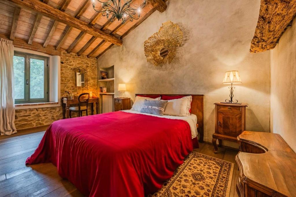Postel nebo postele na pokoji v ubytování B&B Podere Camaiano