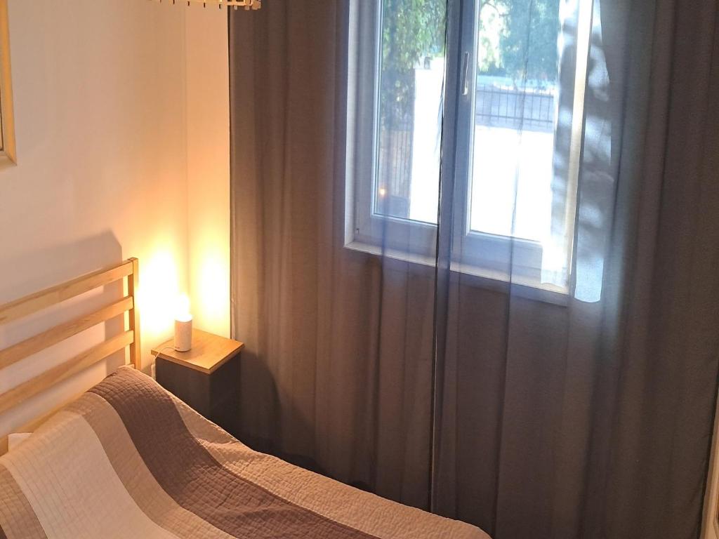 Postel nebo postele na pokoji v ubytování Apartments Trstenica