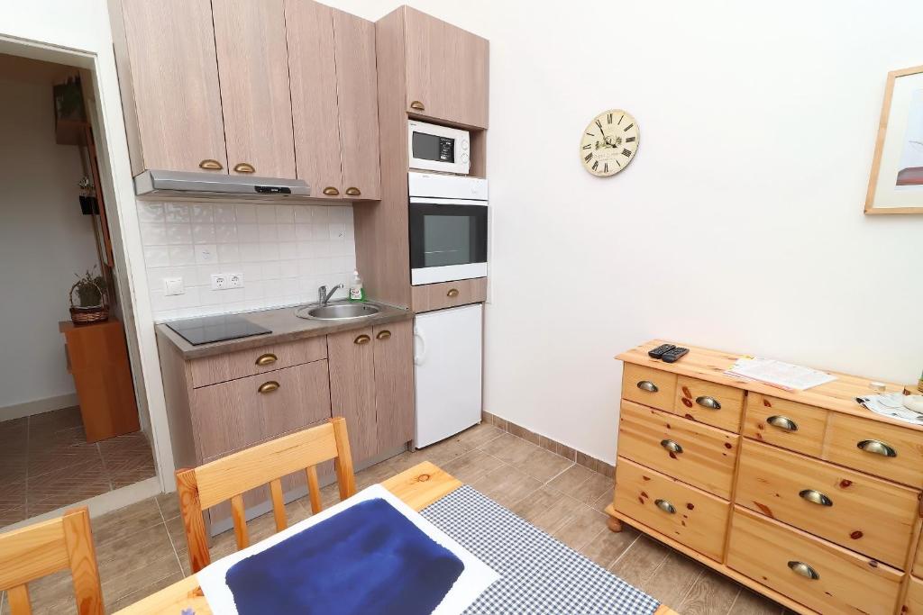 Kuchyň nebo kuchyňský kout v ubytování Apartments Trstenica
