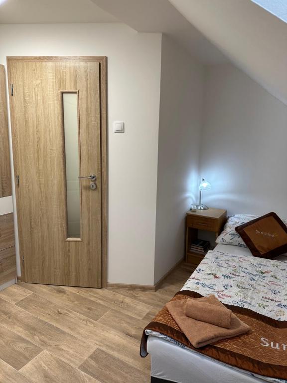 Postel nebo postele na pokoji v ubytování Sunshine Pension