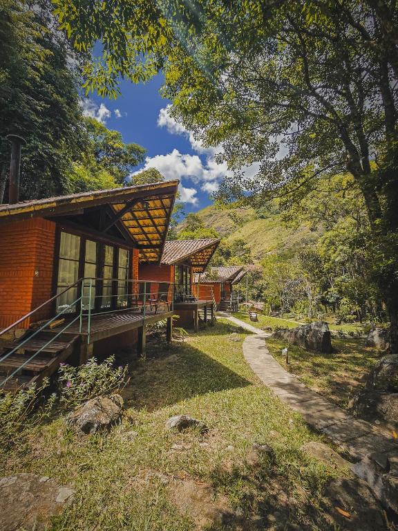 a resort building with a pathway leading to it at Pousada Conde Redondo in Lumiar