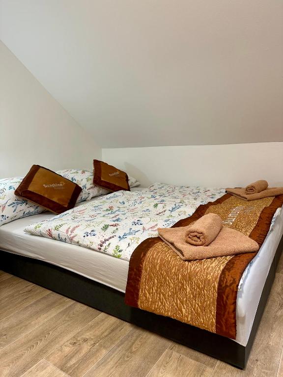 Postel nebo postele na pokoji v ubytování Sunshine Pension