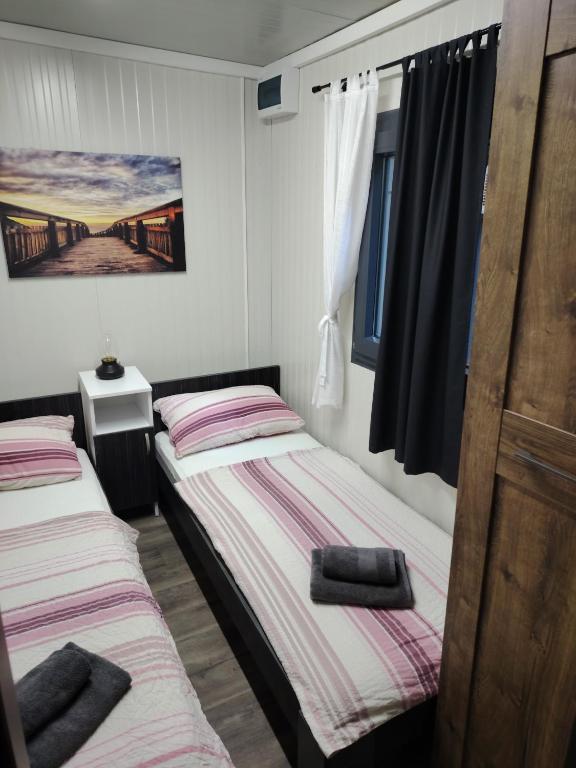 Postel nebo postele na pokoji v ubytování Mobile home Amfora