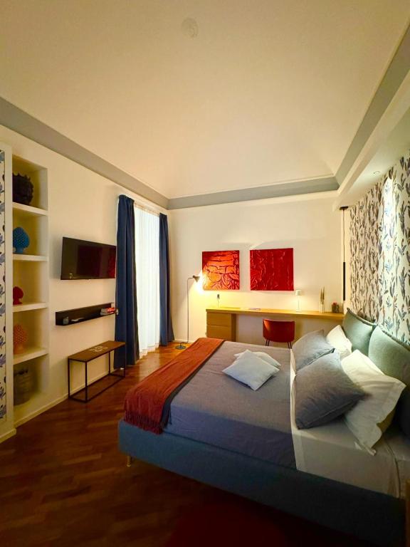 Ένα ή περισσότερα κρεβάτια σε δωμάτιο στο Duomo Leonardo31 Dimora di Charme