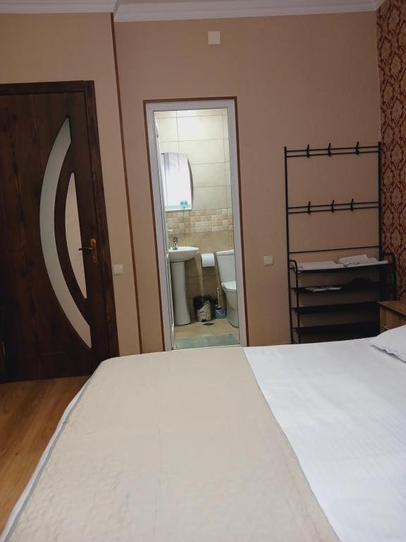 Postel nebo postele na pokoji v ubytování MANGO Guesthouse
