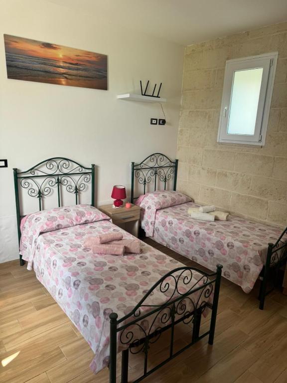 Postel nebo postele na pokoji v ubytování Salento Villa Don Peppino