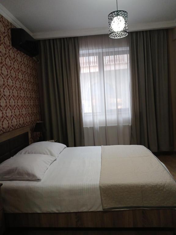 Postel nebo postele na pokoji v ubytování MANGO Guesthouse