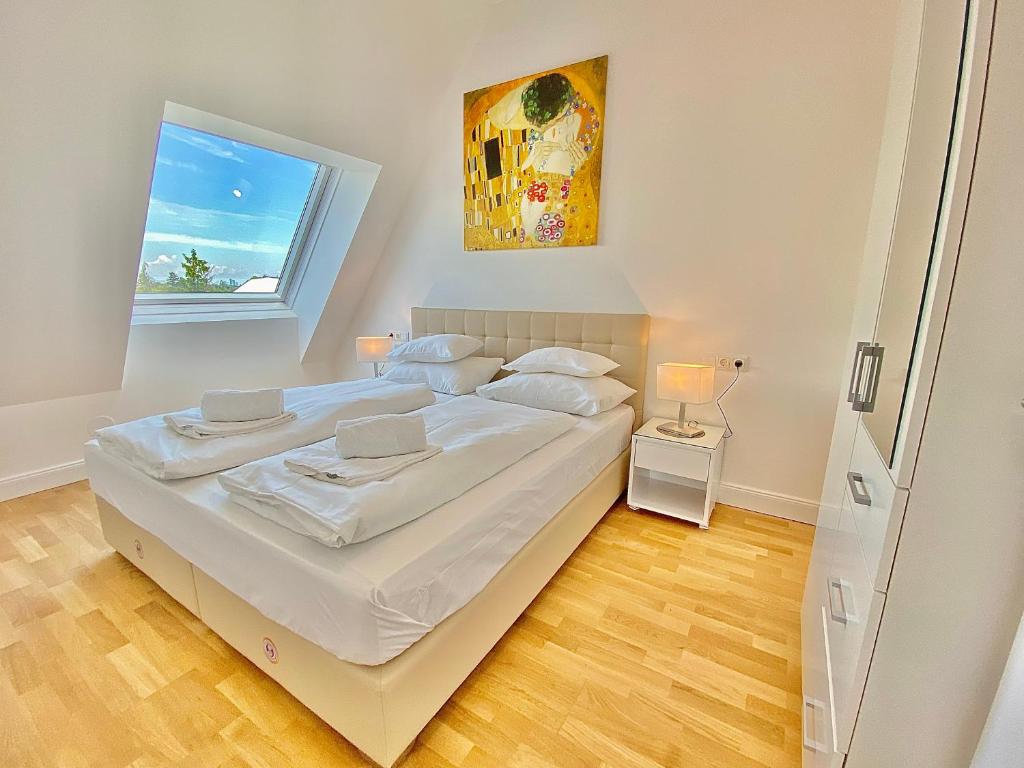 Postel nebo postele na pokoji v ubytování Steiner Residences Mödling