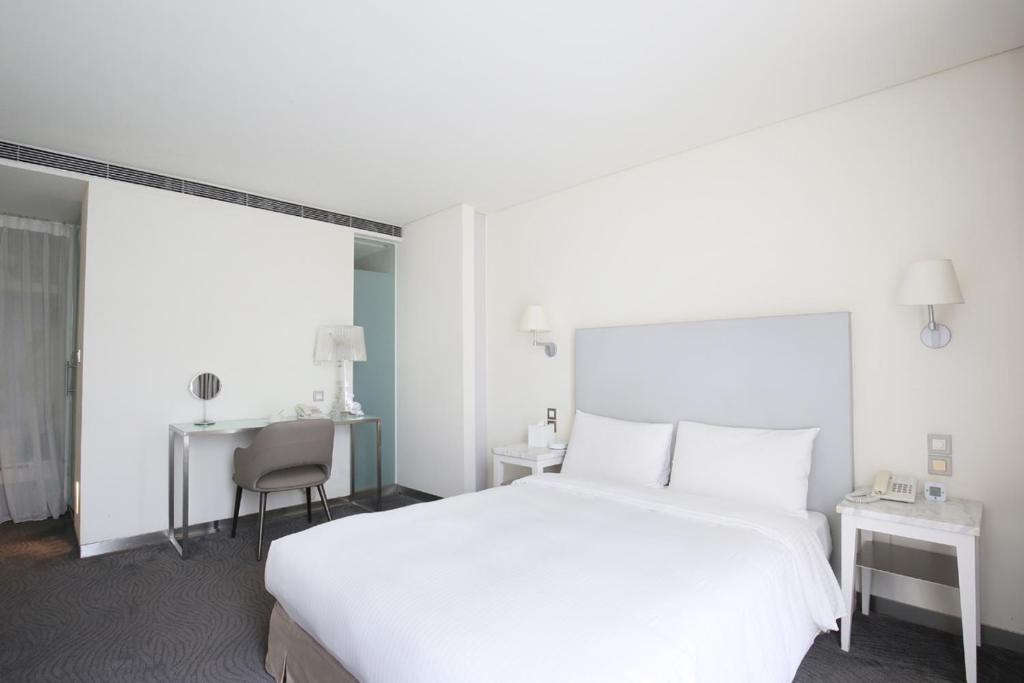 Postel nebo postele na pokoji v ubytování Ambience Hotel Taipei
