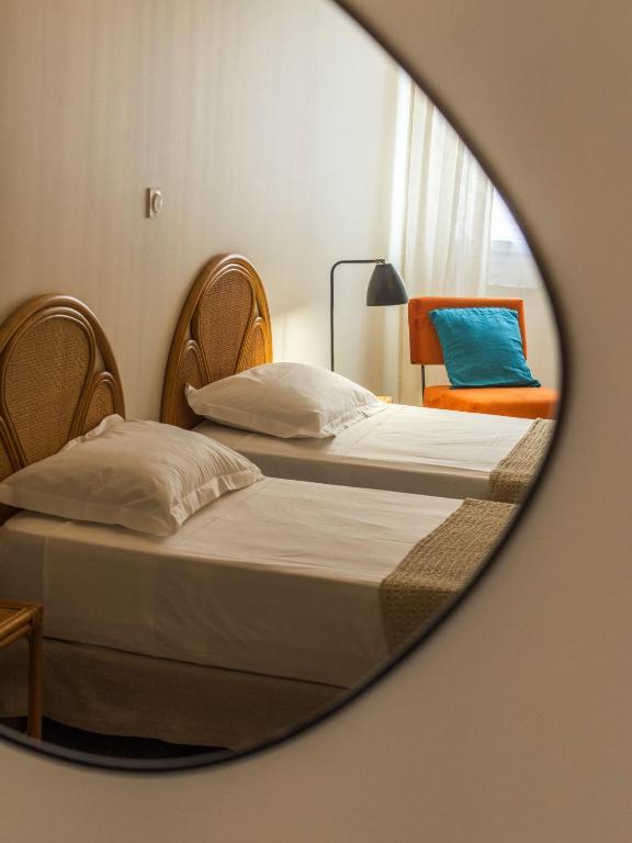 Postel nebo postele na pokoji v ubytování Casa Orfea